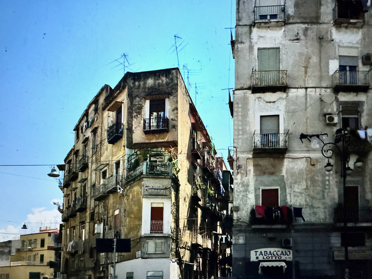 Rione Sanità, Naples, Italy - the corner that stands between two murals and that looks on to the bridge